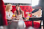 Women having breakfast together in cafe