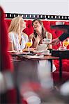 Women having breakfast together in cafe