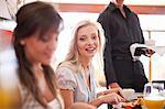 Women having breakfast together in cafe