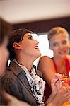 Women having drinks together at bar