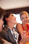 Women having drinks together at bar