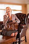 Businesswoman on cell phone in lobby