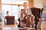 Businesswoman digging through purse