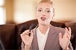 Businesswoman talking at desk