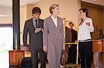 Business people walking in hotel lobby