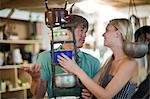 Couple shopping together in thrift store