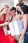 Women looking in shopping bags