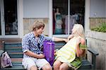 Man admiring girlfriend's shopping