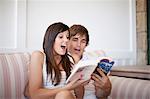 Couple reading travel book together