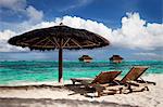 Chairs and umbrella on tropical beach