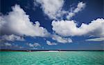 Clouds over sandbar and tropical water