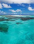 Clouds over sandbar and tropical water