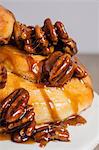 Close up of pecans on sticky buns