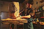 Sculptor carving wood