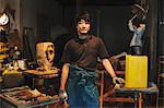 Sculptor in his studio