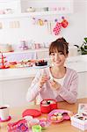 Mother and daughter with sweets in the kitchen