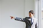 Businessman pointing a finger