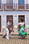 South America, Brazil, a tambor drummer and dancer from the Tambor de Crioula group Catarina Mina, in the streets of Sao Luis MR