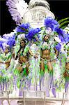 South America, Rio de Janeiro, Rio de Janeiro city, costumed dancers wearing feathers at carnival in the Sambadrome Marques de Sapucai