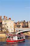 United Kingdom, England, North Yorkshire, A tourist boat on the River Ouse near Lendal Bridge.