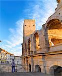 France, Provence, Arles, Man looking towards Roman Amphitheatre. MR