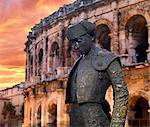 France, Provence, Nimes,  Roman ampitheatre, Toreador statue at sunset