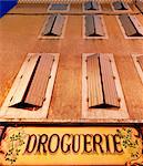 France, Provence, Orange, Droguerie shop front at night