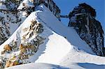 Europe, France, French Alps, Haute Savoie, Chamonix, Aiguille du Midi, skiers walking down the ridge at the start of Vallee Blanche off piste