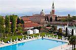 The swimming pool at the Hotel Cipriani in Venice, with the Church of San Giorgio Maggiore in the background, Italy