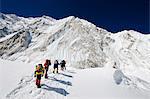 Asia, Nepal, Himalayas, Sagarmatha National Park, Solu Khumbu Everest Region, climbers walking below Nuptse making their way to camp 2 on Mt Everest