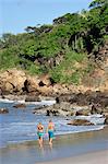 Couple walking on beach at the Aqua Wellness Resort, Nicaragua, Central America