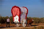 Seville, Andalusia, Spain. Colourful wagons on the way to the village of El Rocio during the El Rocio Pilgrimage