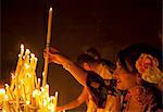 El Rocio, Huelva, Southern Spain. Believers lighting candles during the annual Romeria of El Rocio