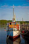 Gothenburg, Sweden. A wooden boat converted into a cafe moored in the old port area of the city.