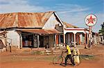 An old Caltex petrol sign outside a corner shop in Bukedea, Uganda, Africa