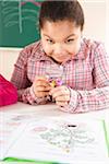 Portrait of Girl Looking at Flower in Classroom, Baden-Wurttemberg, Germany