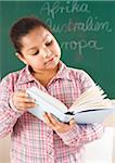 Girl Reading Textbook in Classroom, Baden-Wurttemberg, Germany