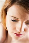 Close-up Portrait of Teenaged Girl Looking Downward