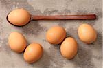 Overhead View of Eggs and Wooden Spoon