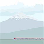 The modern passenger train against the mountain of Fujiyama. Japanese landscape.