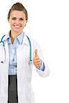 Smiling medical doctor woman showing thumbs up