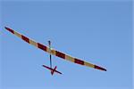 RC glider flying in the blue sky, closeup