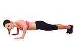 Beautiful fit healthy young woman athlete working out during her training doing press ups