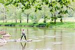 woman fishing in Sazava river, Czech Republic