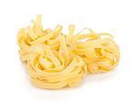 Fettuccine nest pasta. Isolated on white background