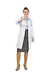 Full length portrait of medical doctor woman showing thumbs up