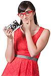 Pensive woman with red eyeglasses and camera