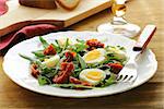 salad with sun dried tomato and quail eggs