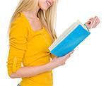 Closeup on student girl reading book