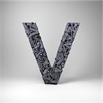 Letter V made out of scrambled small letters in studio setting